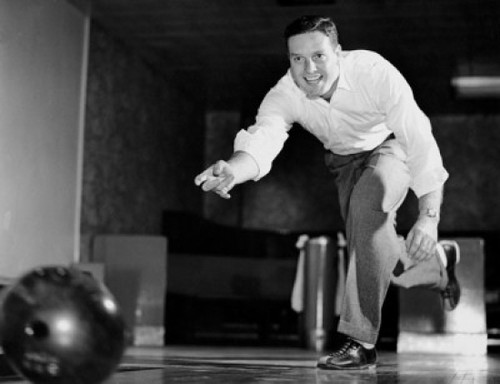 Low angle view of a young adult man bowling Poster Print - Item # VARSAL25524295A
