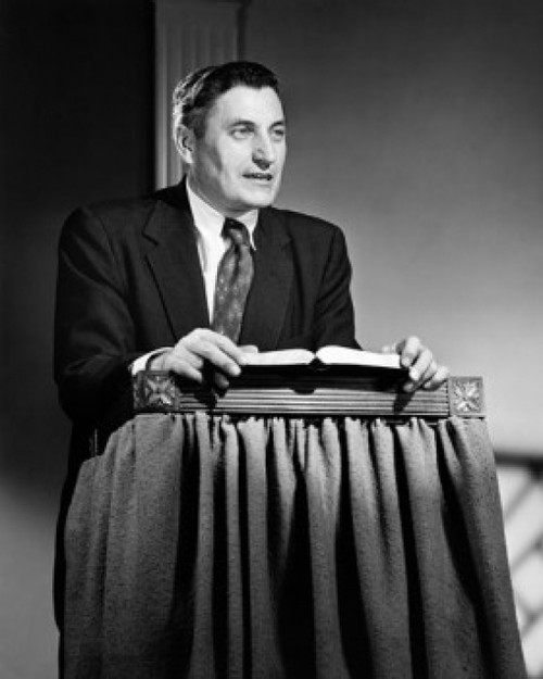 Mid adult man standing at a lectern and talking Poster Print - Item # VARSAL25543265