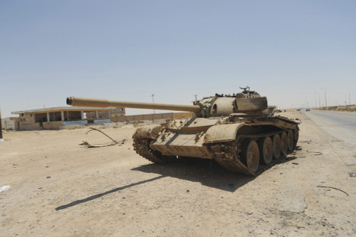 A T-55 tank destroyed by NATO forces in the desert north of Ajdabiya, Libya. A war betwean Gaddafi army and Libya's Transitional National Council army with air support from NATO started on March 17, 2011. Poster Print - Item # VARPSTACH100286M