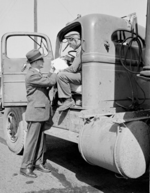 Man sitting in truck and talking with man in suit Poster Print - Item # VARSAL255422129