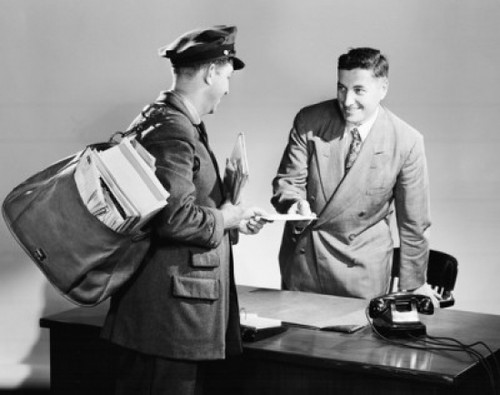 Side profile of a postman giving mail to a businessman Poster Print - Item # VARSAL2559069