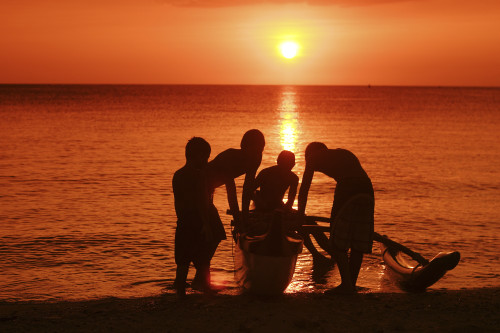 USA, Hawaii, Oahu, Boys holding canoe at sunset; North Shore PosterPrint - Item # VARDPI1979241