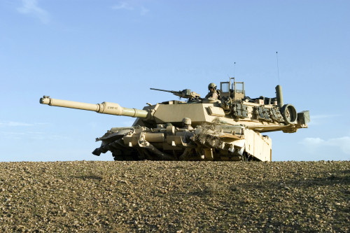 March 9, 2007 - U.S. Marines provide security in an M1A1 Abrams tank while fellow Marines search for weapons caches along a section of the west bank of the Euphrates River, north of Hit, Iraq. Poster Print - Item # VARPSTSTK102286M March 9, 2007 - U.S. Marines provide security in an M1A1 Abrams tank while fellow Marines search for weapons caches along a section of the west bank of the Euphrates River, north of Hit, Iraq. Poster Print - Item # VARPSTSTK102286M