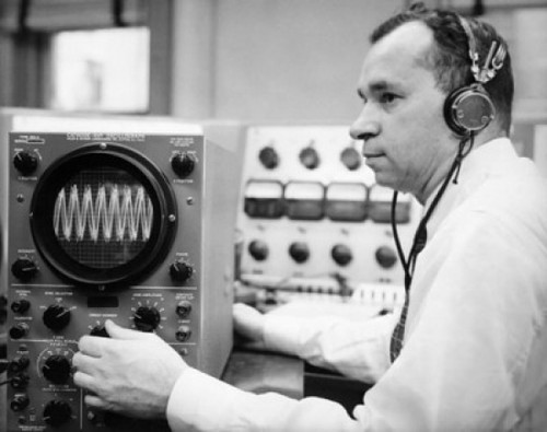 Side profile of a mid adult man operating an oscillograph Poster Print - Item # VARSAL25535323