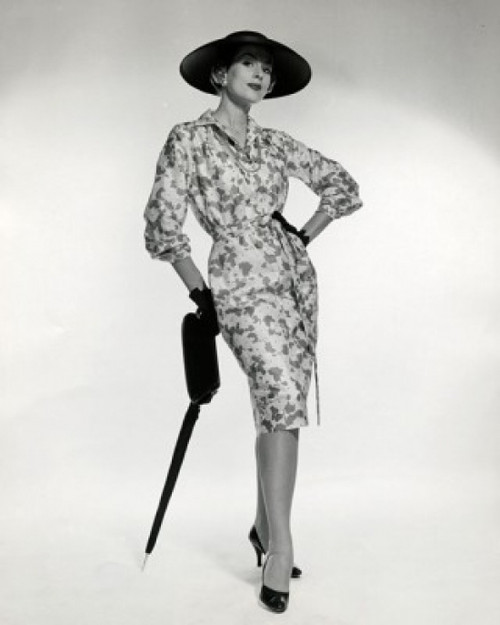 Portrait of elegant young woman leaning on umbrella Poster Print - Item # VARSAL25542229