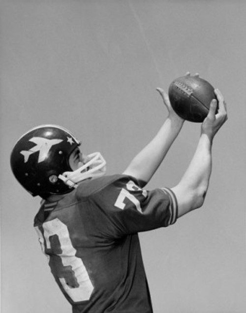 Football player catching football Poster Print - Item # VARSAL2554746
