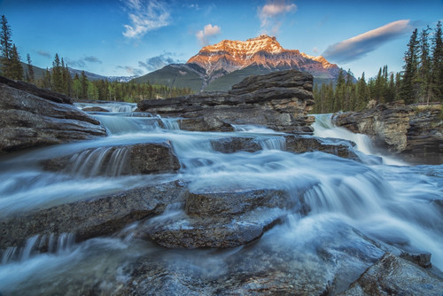 Sunset lights up Mount Fryatt as the Athabasca River flows over Athabasca Falls in Jasper National Park; Alberta, Canada PosterPrint - Item # VARDPI12252434