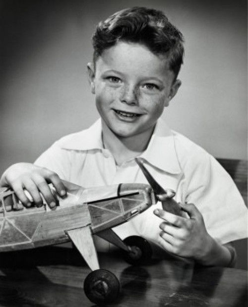 Portrait of boy holding model airplane Poster Print - Item # VARSAL2553264