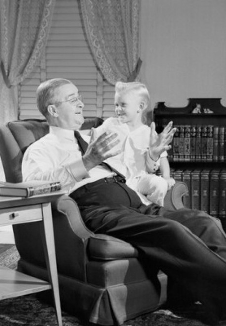 Grandfather and grandson sitting in armchair Poster Print - Item # VARSAL255419107D