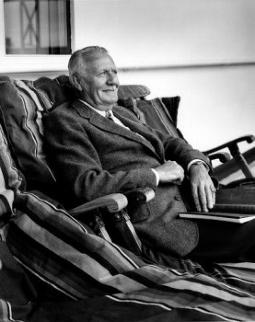 Senior man relaxing in porch swing Poster Print - Item # VARSAL25528309