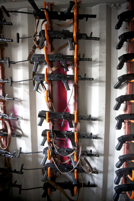 AKM assault rifles lined up on the wall in the armory Poster Print - Item # VARPSTTMO100460M
