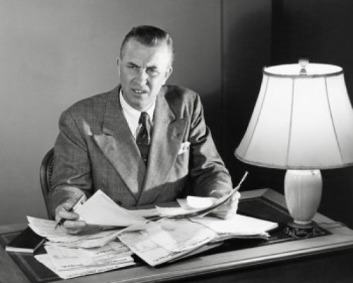 Businessman doing paperwork in an office Poster Print - Item # VARSAL25548288