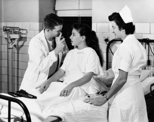 Male doctor examining the eyes of a patient Poster Print - Item # VARSAL25525328