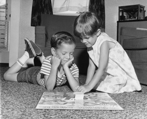Boy and his sister playing a board game Poster Print - Item # VARSAL25516465