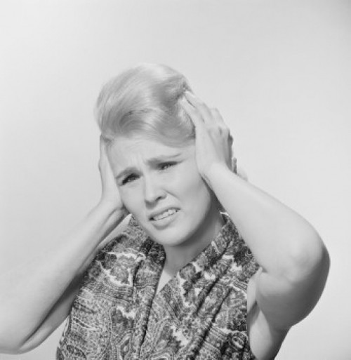Studio portrait of young woman with head in hands Poster Print - Item # VARSAL255422366