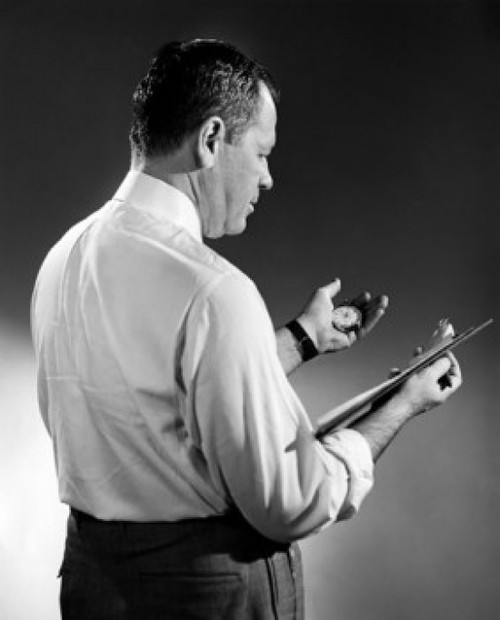 Side profile of a businessman holding a clipboard and a stopwatch Poster Print - Item # VARSAL25527984