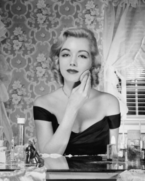 Young woman applying make-up to face Poster Print - Item # VARSAL25526034A