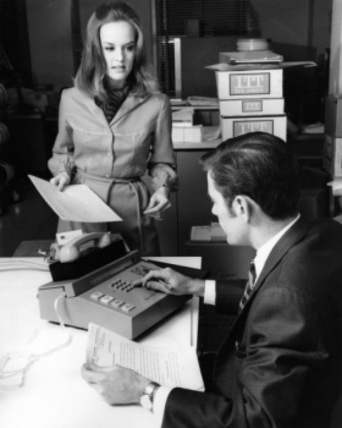 Businesswoman and businessman talking in office Poster Print - Item # VARSAL25548783