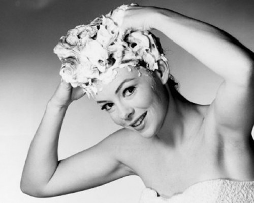 Portrait of a young woman shampooing her hair Poster Print - Item # VARSAL25527247C