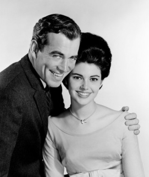 Studio portrait of couple embracing Poster Print - Item # VARSAL255417885
