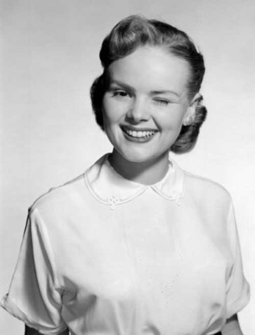 Studio portrait of young woman winking Poster Print - Item # VARSAL255416880B Studio portrait of young woman winking Poster Print - Item # VARSAL255416880B