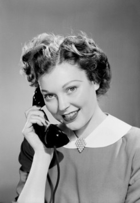 Young woman talking on landline phone Poster Print - Item # VARSAL255422319