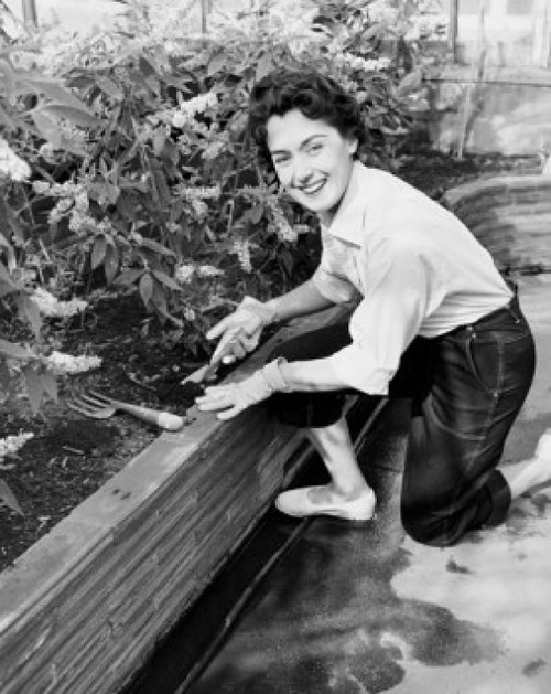 Portrait of a young woman gardening Poster Print - Item # VARSAL25532230