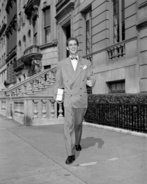 Young man walking on sidewalk Poster Print - Item # VARSAL255417965