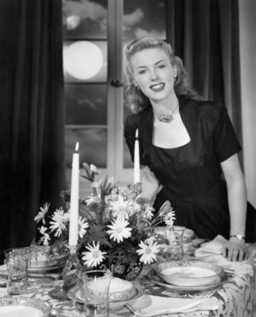 Portrait of a young woman standing near a dining table Poster Print - Item # VARSAL25527180