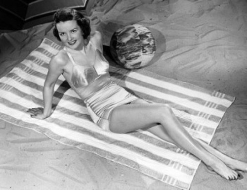 High angle view of a young woman reclining on the beach Poster Print - Item # VARSAL2557267