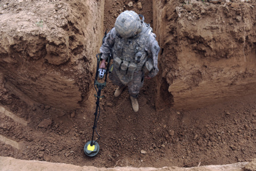 March 27, 2010 - U.S. Army Specialist searches for a weapons cache in Kirkuk, Iraq Poster Print - Item # VARPSTSTK103521M March 27, 2010 - U.S. Army Specialist searches for a weapons cache in Kirkuk, Iraq Poster Print - Item # VARPSTSTK103521M