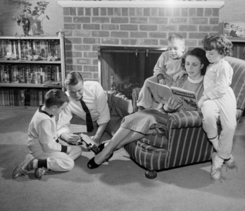 Family with tree children in living room Poster Print - Item # VARSAL255420137