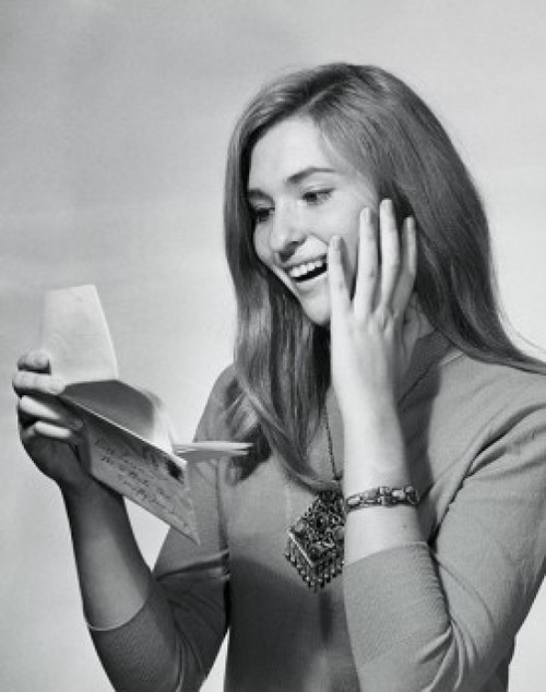 Close-up of a teenage girl looking at a letter and smiling Poster Print - Item # VARSAL255913D