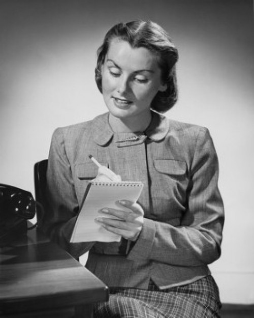 Young woman writing on a notepad Poster Print - Item # VARSAL2553078