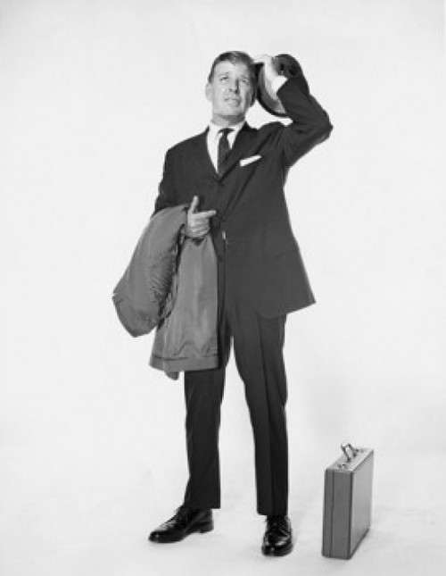 Mature businessman holding hat and overcoat Poster Print - Item # VARSAL25548204