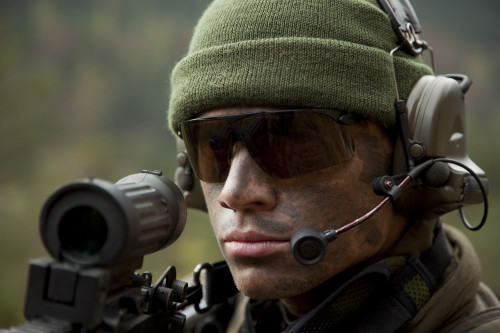 U.S. special forces soldier stays alert while wearing a radio headset during combat Poster Print - Item # VARPSTTWE300079M