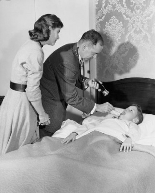 Side profile of a male pediatrician examining a boy's throat Poster Print - Item # VARSAL25515180