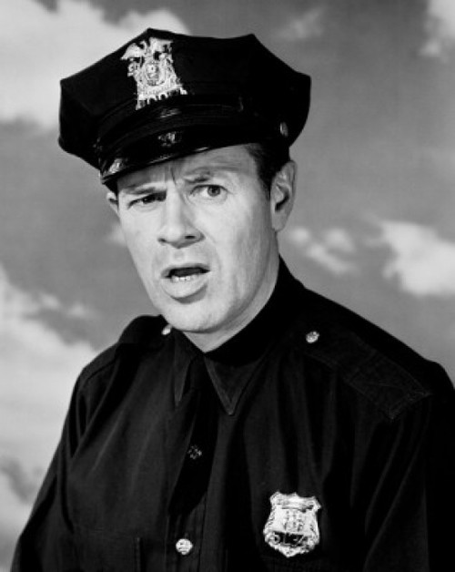 Portrait of police officer frowning Poster Print