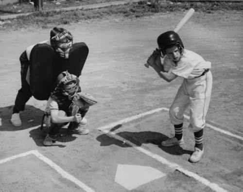 Batter swinging a bat with a catcher and an umpire crouching behind him Poster Print - Item # VARSAL25520438