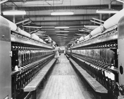 Side profile of a woman working on a spinning frame in a textile factory Poster Print - Item # VARSAL25527141