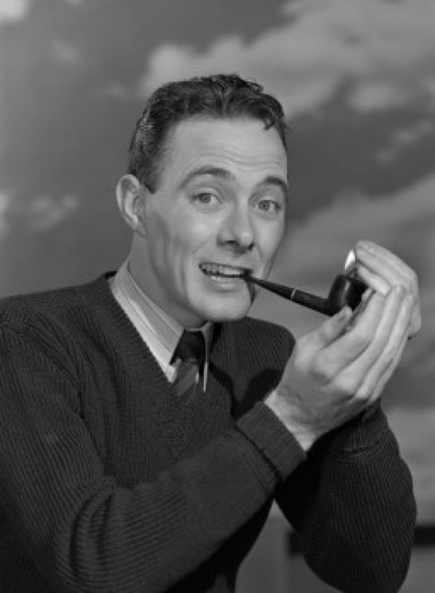 Studio portrait of mid adult man smoking pipe Poster Print - Item # VARSAL25549172