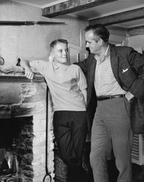 Father standing with his son near a fireplace Poster Print - Item # VARSAL25519629