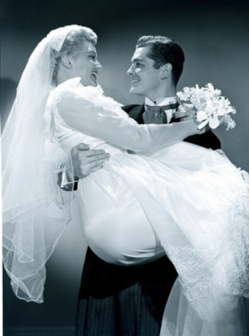 Groom embracing bride holding bouquet Poster Print - Item # VARSAL255417258