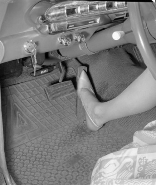 Leg of woman stepping on accelerator Poster Print - Item # VARSAL25549357