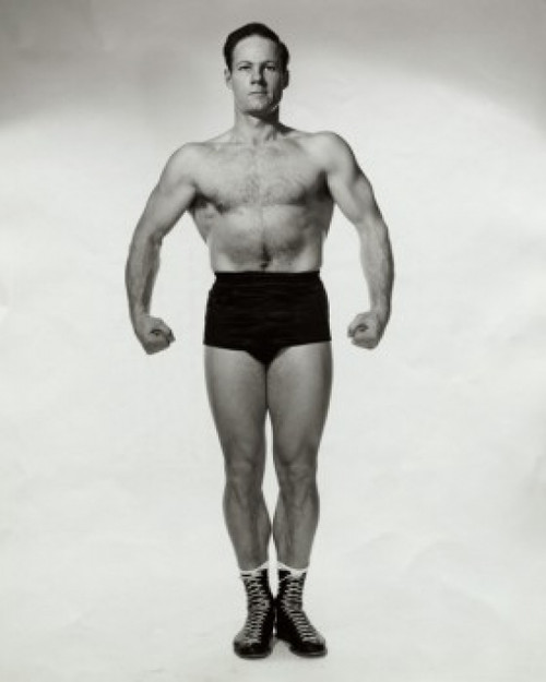 Young man flexing his muscles Poster Print - Item # VARSAL25520180