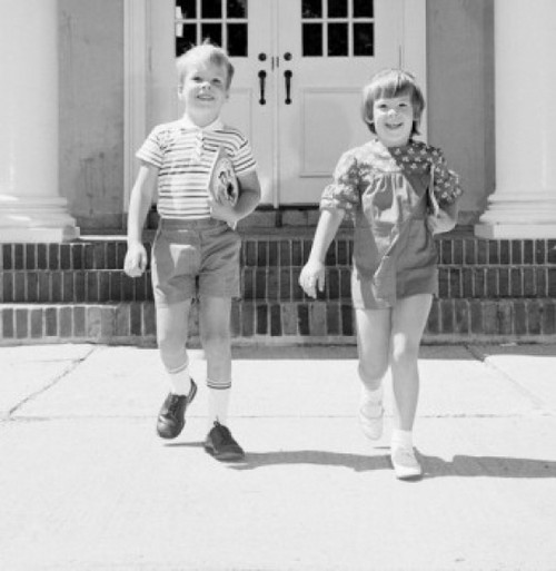 Children leaving school carrying books Poster Print - Item # VARSAL255422393