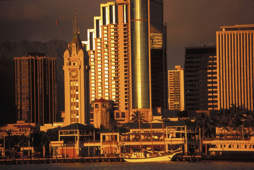 Hawaii, Oahu, Aloha Tower, Honolulu Harbor, And Downtown Cast In A Golden Hue PosterPrint - Item # VARDPI1990928