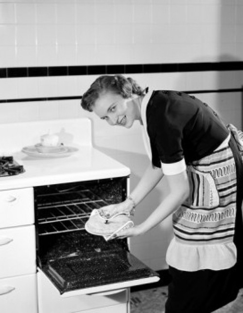 Smiling woman taking out pie from oven Poster Print - Item # VARSAL255423262