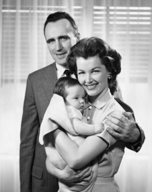 Smiling parents with baby Poster Print - Item # VARSAL2553172A