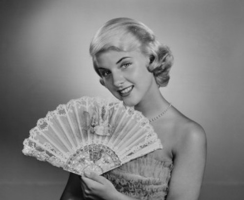 Portrait of young woman holding fan Poster Print - Item # VARSAL255419020